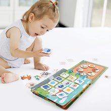 Child playing with the Montessori Quiet Book animal numbers puzzle game on a white surface.