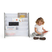 Child reading beside a Wooden Kids Book Rack bookshelf during daily reading and nursery playtime.