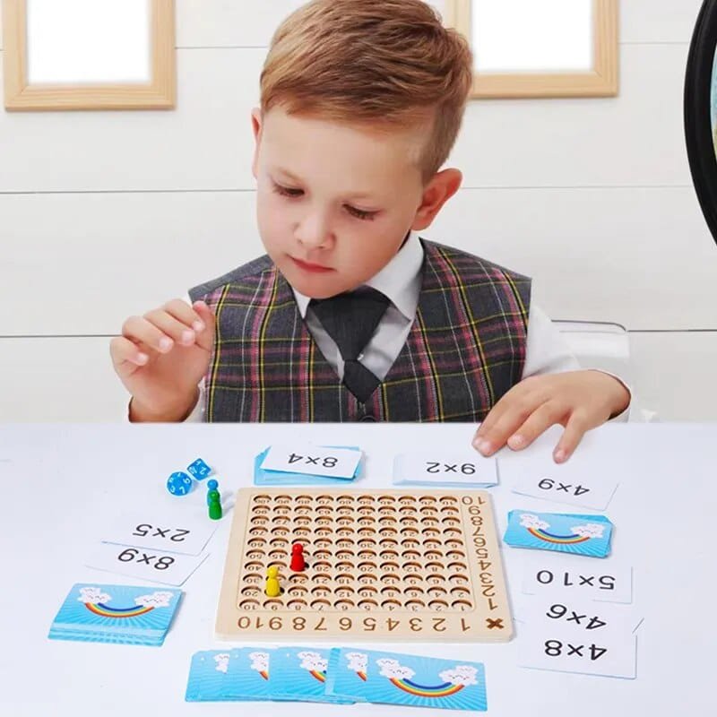 Child using the wooden multiplication board at a table, an educational maths toy for homework practice and classroom learning.