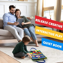 Family in a living room with a child playing with a colorful quiet book.