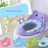 Purple octopus-shaped potty seat with armrests on a toilet, surrounded by smaller octopus toys.