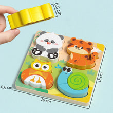 Wooden puzzle board with panda, tiger, owl and snail pieces, 18 by 18 cm, with a hand holding a piece
