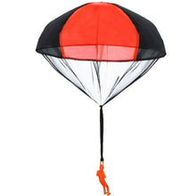 Toy parachute with a red top and black sides.