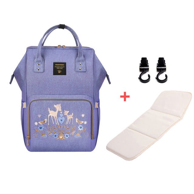 Purple backpack with deer design, white cushion, and black straps.