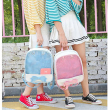 Clear Itabag with Bow-knot anime style backpack held by friends near a brick wall for street style outings.