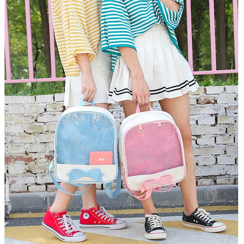 Clear Itabag with Bow-knot anime style backpack held by friends near a brick wall for street style outings.