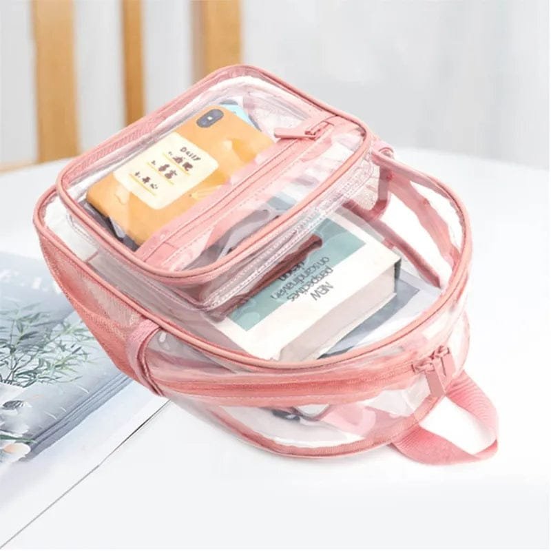 Packed interior of the pink clear PVC backpack with books and a phone, keeping essentials visible and organised.