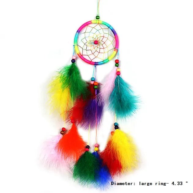 Colorful feather dream catcher handmade in an ethnic rattan design for boho decor.