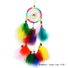 Colorful feather dream catcher handmade in an ethnic rattan design for boho decor.