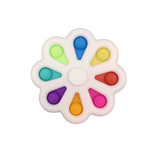 Colorful flower shaped push pop fidget spinner for sensory play and stress relief.