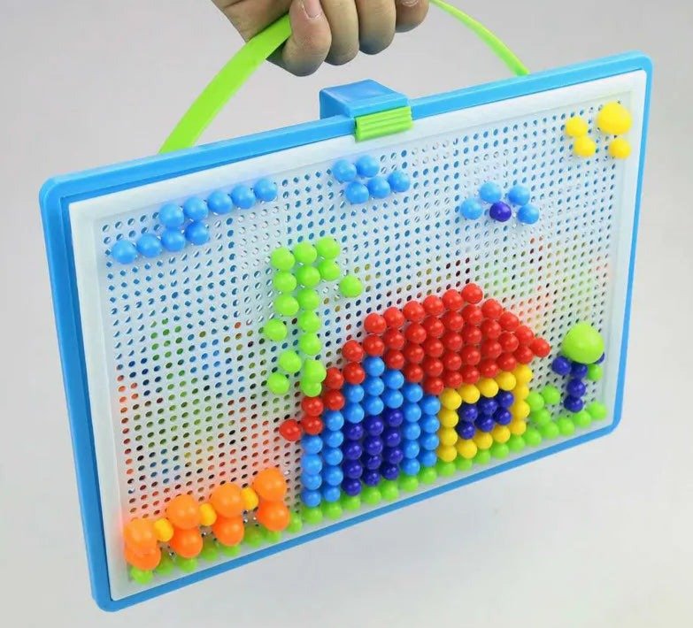 Colorful magnetic building board with a house and garden design.