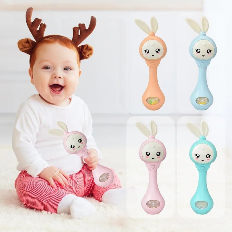 Baby with toy rattle and colorful rattles