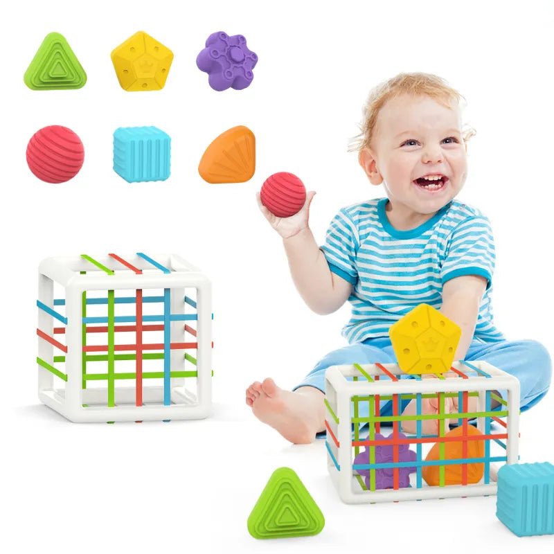 Child playing with colorful toys, including a cube and various shapes 
