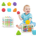 Child playing with colorful toys, including a cube and various shapes 