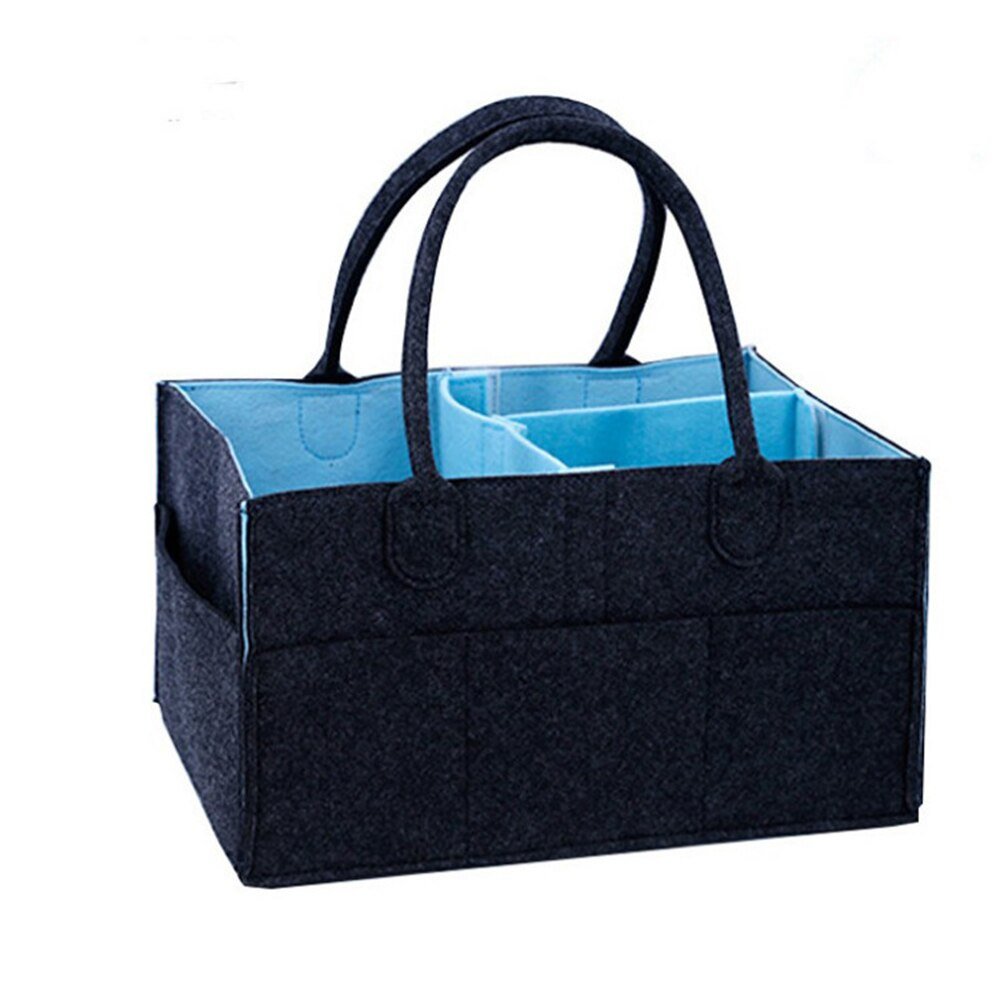 Compact black fabric diaper tote with blue interior for nursery storage in tight spaces.