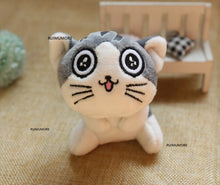 Front view of the compact cat plush doll keyring charm, a 9cm stuffed toy for clipping onto keys, bags, and pencil cases.