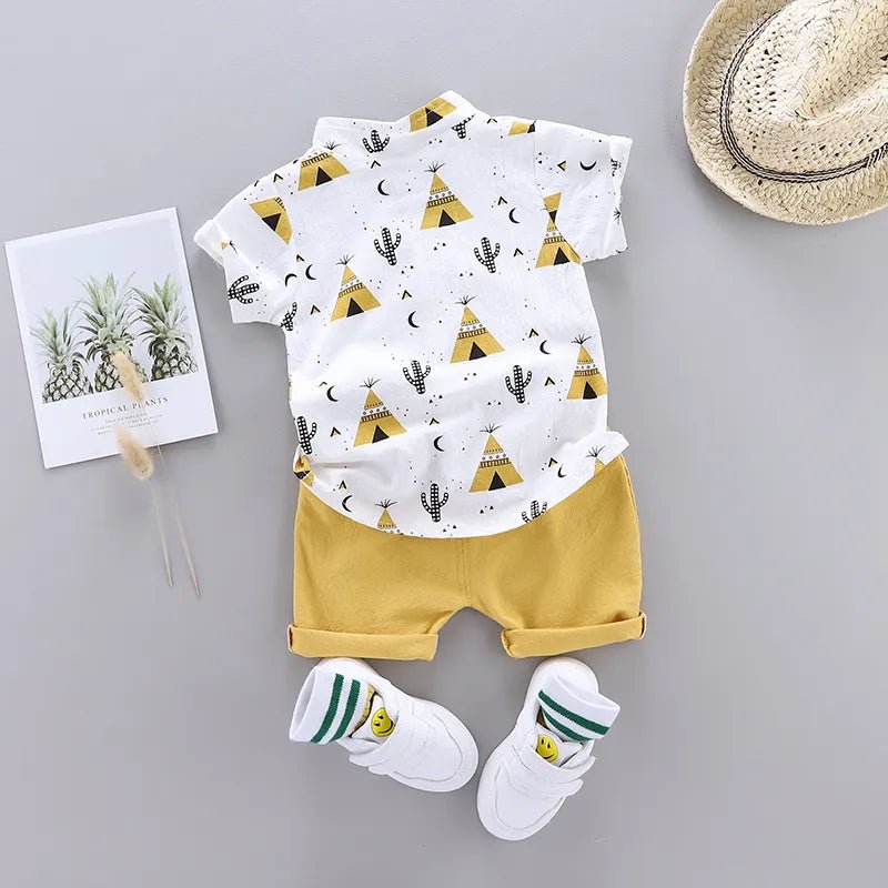 Children's outfit with white shirt and yellow shorts, accompanied by a hat and socks 