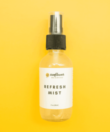 Refresh Mist skincare spray bottle label detail for hydrating the face during hot days, travel, and after cleansing.