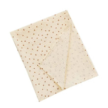 Super Soft Cotton Gauze Muslin Swaddle and Bath Towel, folded beige blanket with small brown dots, for newborn swaddling, bath time, and stroller outings.