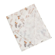 Super Soft Cotton Gauze Muslin Swaddle and Bath Towel, two folded fabric swatches with animal pattern, for newborn swaddling, bath time, and stroller outings.