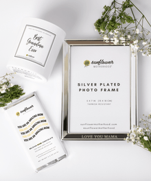 Silver-plated photo frame with 'Sunflower Motherhood' branding.