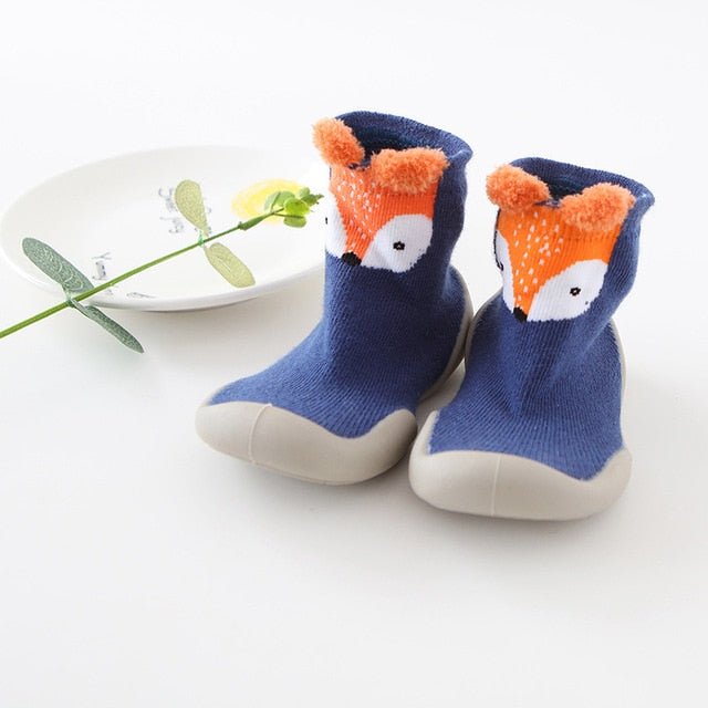 Pair of blue baby socks with a fox design 