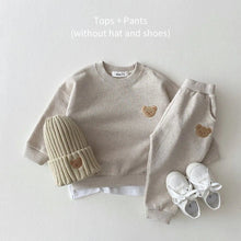Children's outfit with beige sweater, pants, hat, and shoes. (option 4)