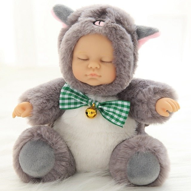 Stuffed animal toy with a green bow tie and bell 