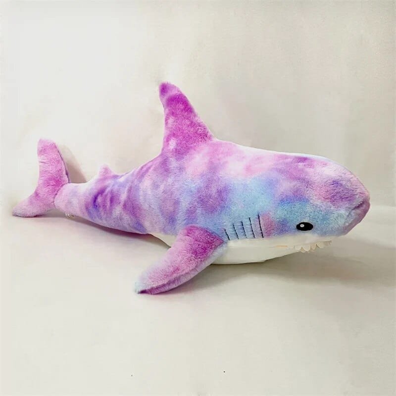 Purple colored shark-shaped plush toy