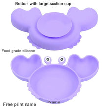 Strong silicone suction base on the purple crab plate, gripping the highchair tray to stop spills and throwing.