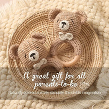 Crochet bear rattle wrist teether bracelet for soothing sore gums and encouraging early hand awareness.