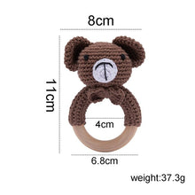Crochet Bear Rattle and Teether plush toy with wooden ring for grasping practice and early motor skill development.