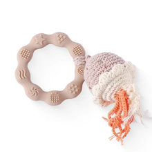 Crochet bell rattle teether bracelet with gentle sound for encouraging baby listening and hand movement.