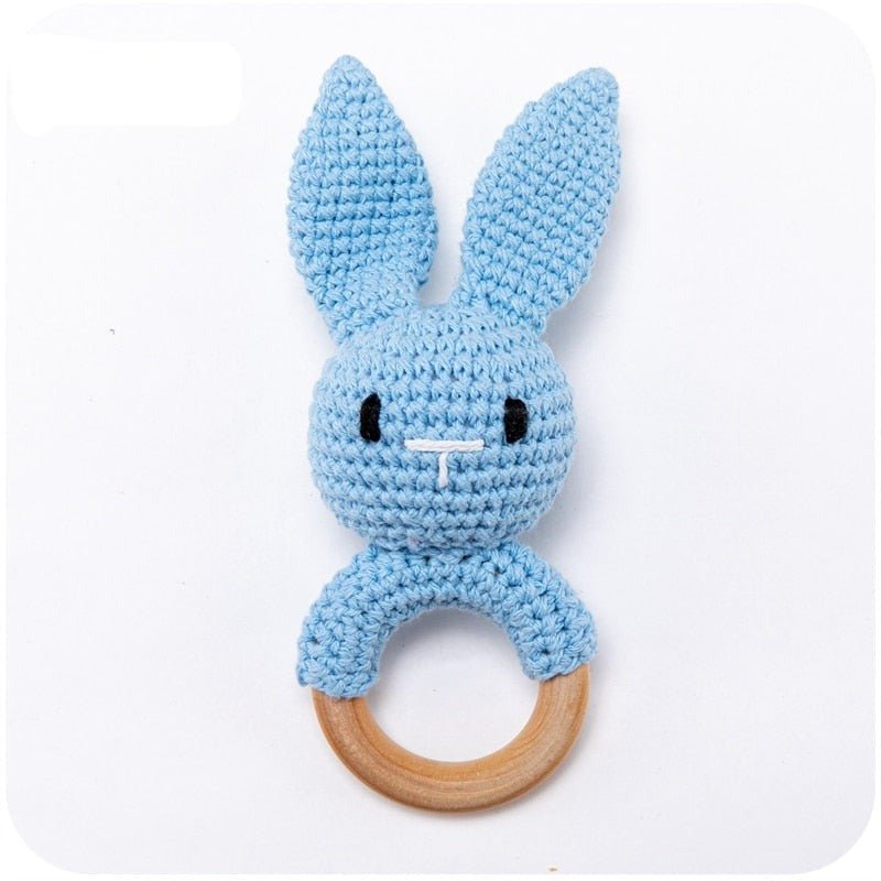 Crochet Blue Bunny Rattle and Teether plush toy with wooden ring styled for teething relief and sensory play.
