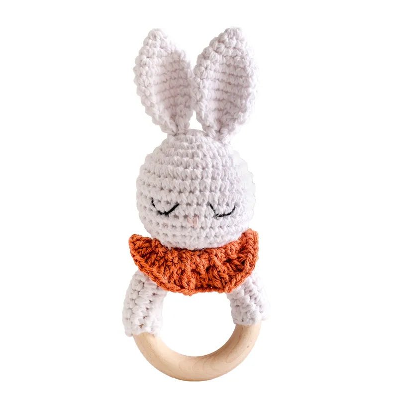 Crochet bunny style teether ring for babies to grasp and mouth during playmat time and travel days.