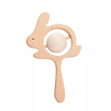 Crochet Bunny Rattle and Teether plush toy with wooden ring close-up for teething comfort during tooth eruption.