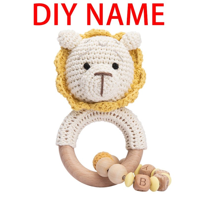 Crochet Bunny Rattle and Teether plush toy with wooden ring for grasping practice and early motor skill development.