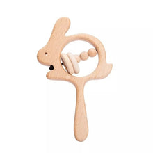 Crochet Bunny Rattle and Teether plush toy with wooden ring for teething comfort during tooth eruption.