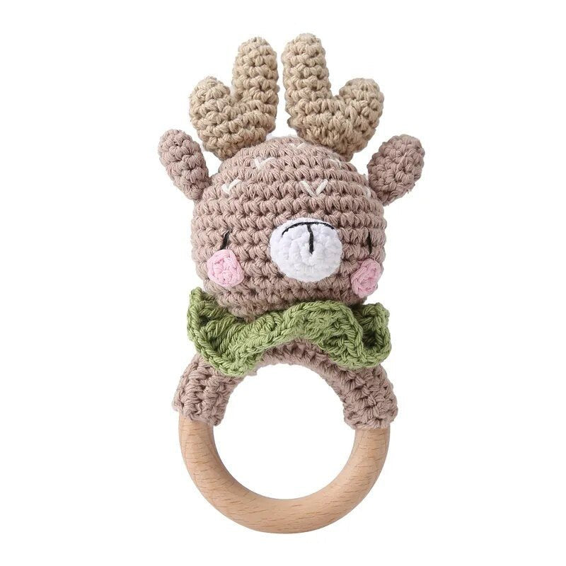 Crochet deer rattle teether ring with woodland styling for teething comfort and nursery photo props.