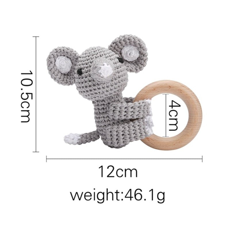 Crochet Elephant Rattle and Teether plush toy with wooden ring close-up for newborn gifting and baby shower presents.