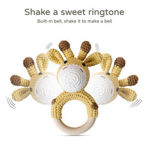 Crochet Giraffe Rattle and Teether plush toy with wooden ring for soothing bedtime comfort.
