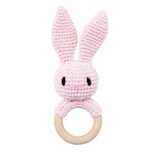 Crochet Pink Bunny Rattle and Teether plush toy with wooden ring styled for playroom decor and thoughtful gift sets.