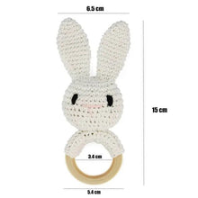 White crochet rabbit rattle teether ring for babies to cuddle and chew during naps and travel.