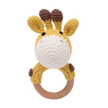 Small crochet rattle teether bracelet sized for tiny hands to hold during newborn grasping practice.