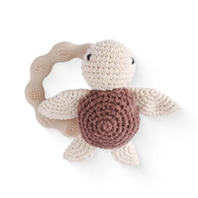 Crochet turtle teether ring for babies to explore texture and shape while easing teething discomfort.