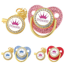 Luxury Crown Pacifier & Clip Set, decorative pacifiers with Prince and Princess text and crowns, in gold, pink, blue, and red, for newborn soothing and daily comfort.