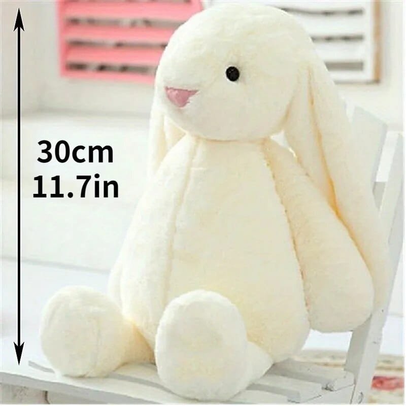 White plush bunny toy with measurement text 