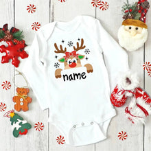 White baby onesie with reindeer design and 'name' text on a wooden surface with Christmas decorations. (option 4)