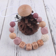 Custom name silicone pacifier clip and teether for keeping a dummy secure during naps, feeds and stroller walks.