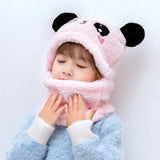 Child wearing a pink panda hat and scarf 